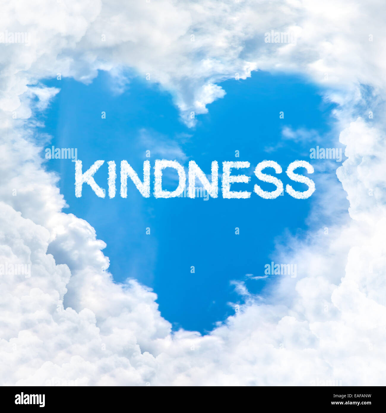 kindness word inside love cloud heart shape blue sky background only Stock Photo