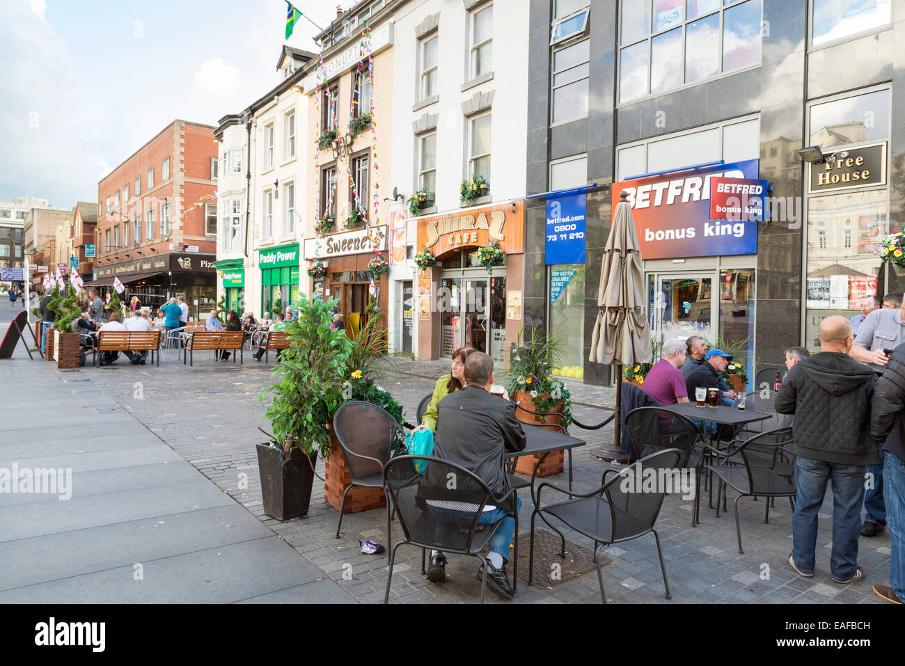 LIVERPOOL, UNITED KINGDOM - JUNE 7, 2014: Saturday afternoon in Liverpool, people have fun in the exterior of a Pub Stock Photo