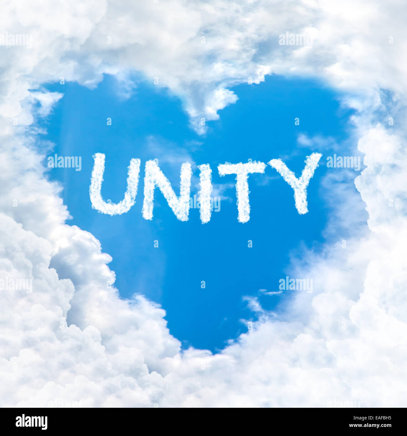 unity word inside heart cloud  blue sky background only Stock Photo