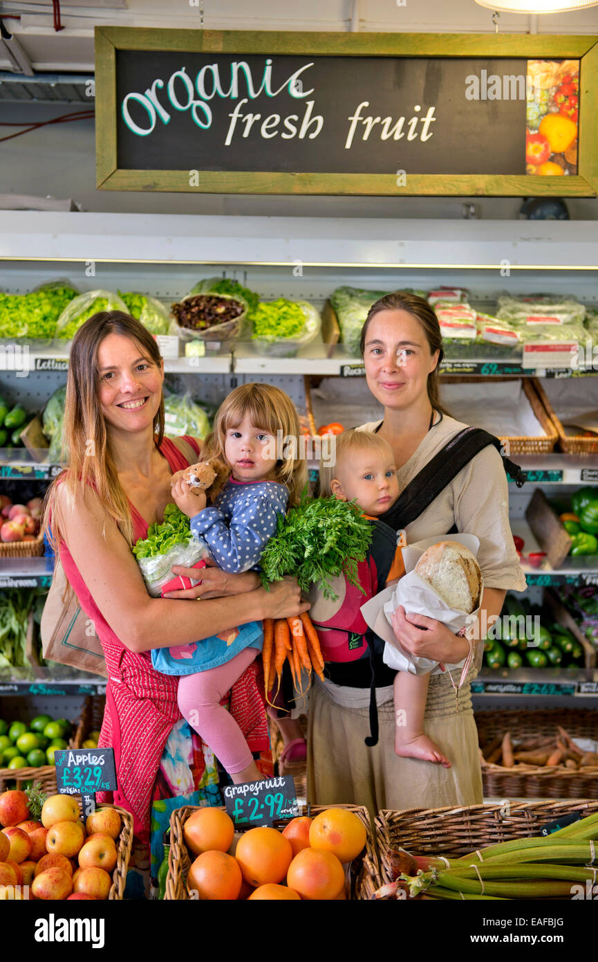 Mothers shopping at the Better Food Company organic supermaket in St. Werburgh's, Bristol UK