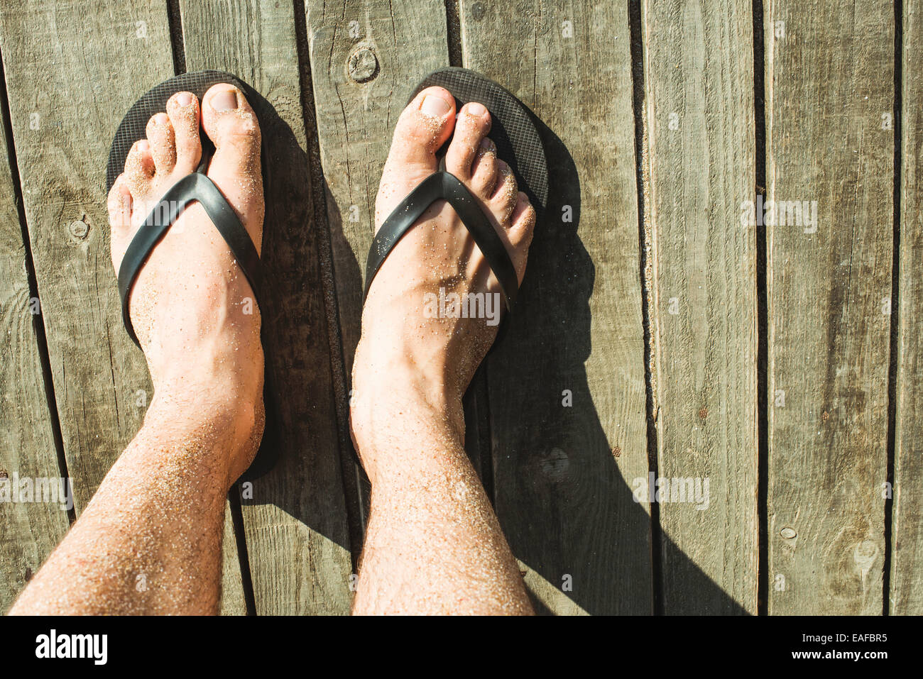 Male foot flip flops hi-res stock photography and images - Alamy