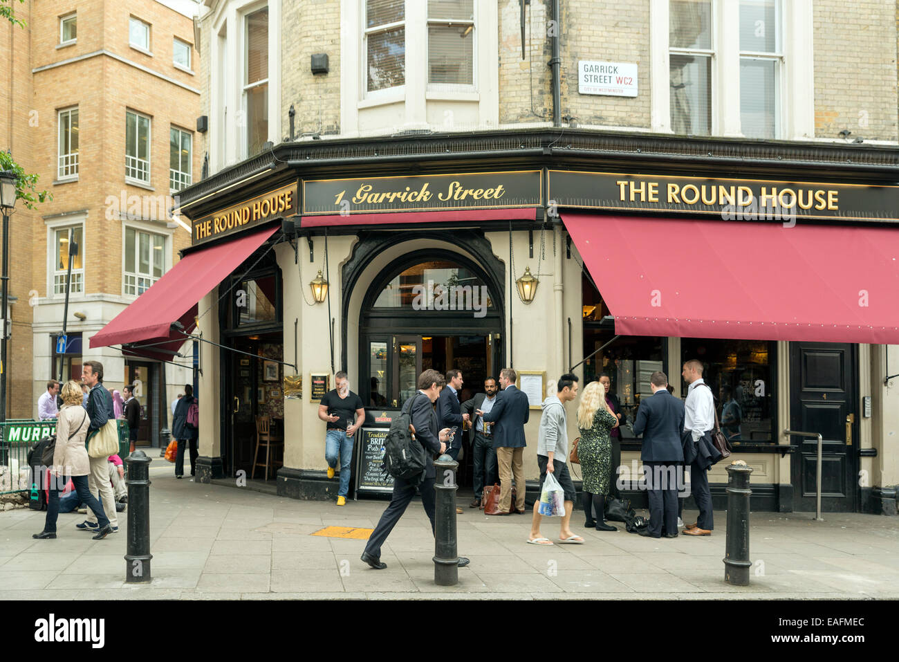 LONDON, UNITED KINGDOM - JUNE 5,  2014: Customers outside 'The Round House' a popular pub near Covent Garden, London Stock Photo