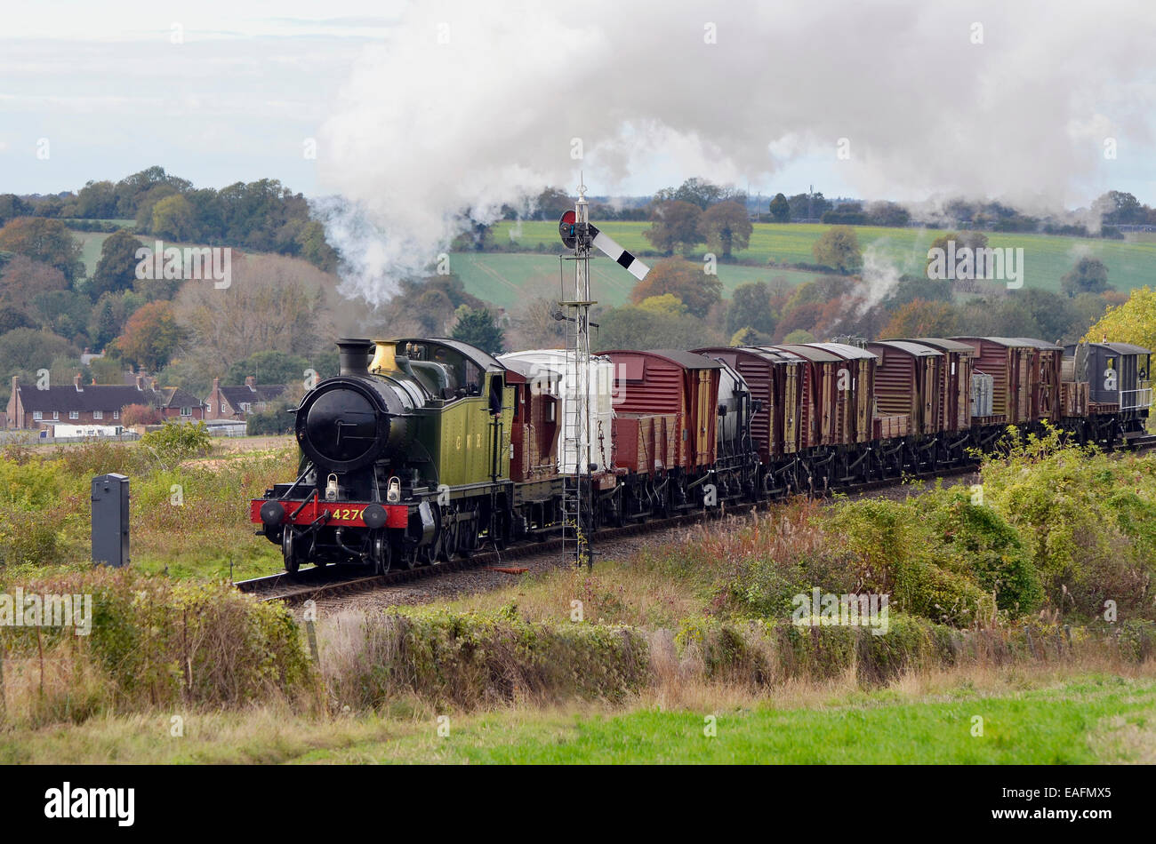 A n ex-GWR 42XX class steam tank engine works a demonstration goods train showing how freight was moved in the 1950's in UK. Stock Photo