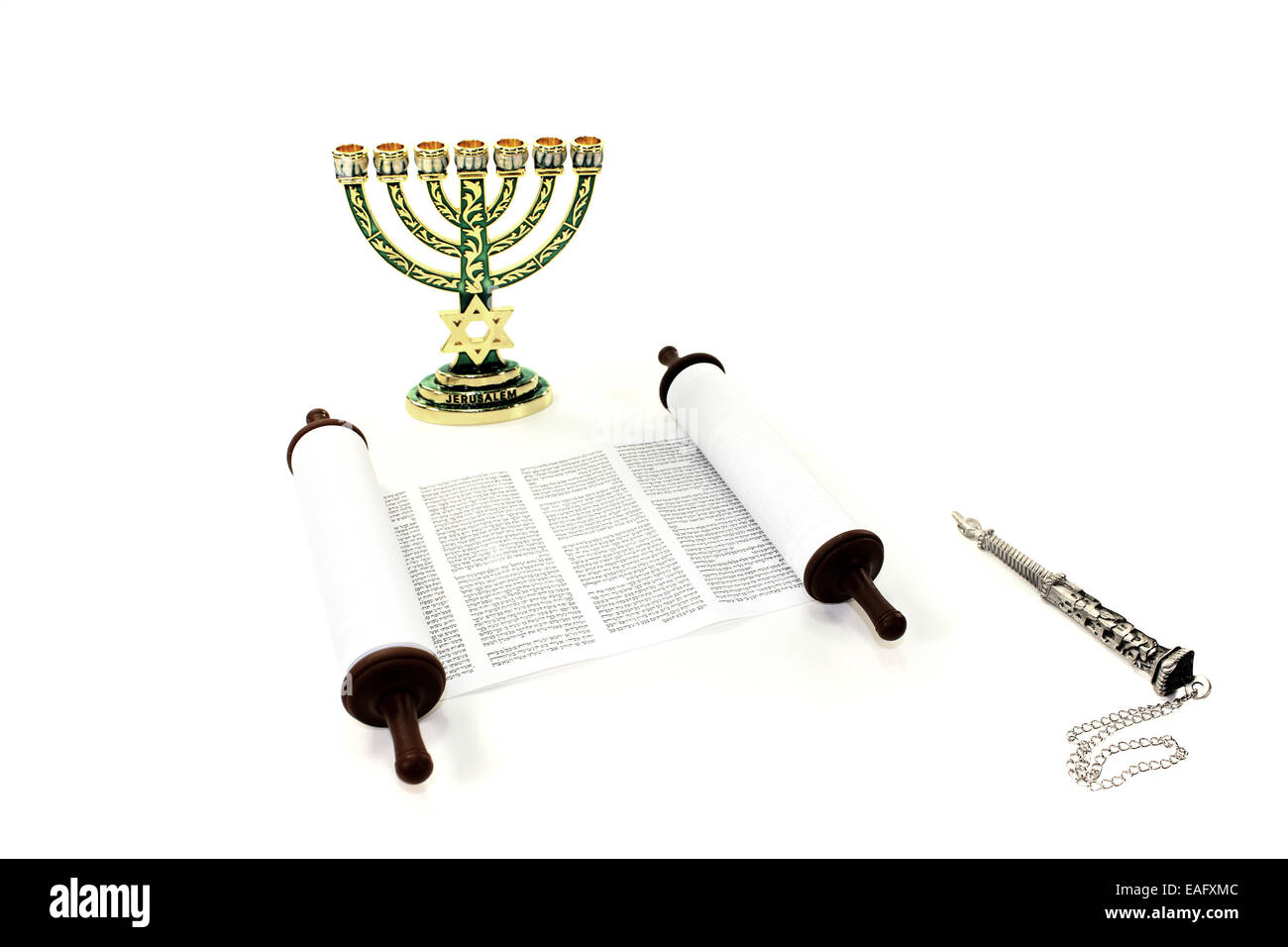 Torah scroll with menorah and pointer on light background Stock Photo