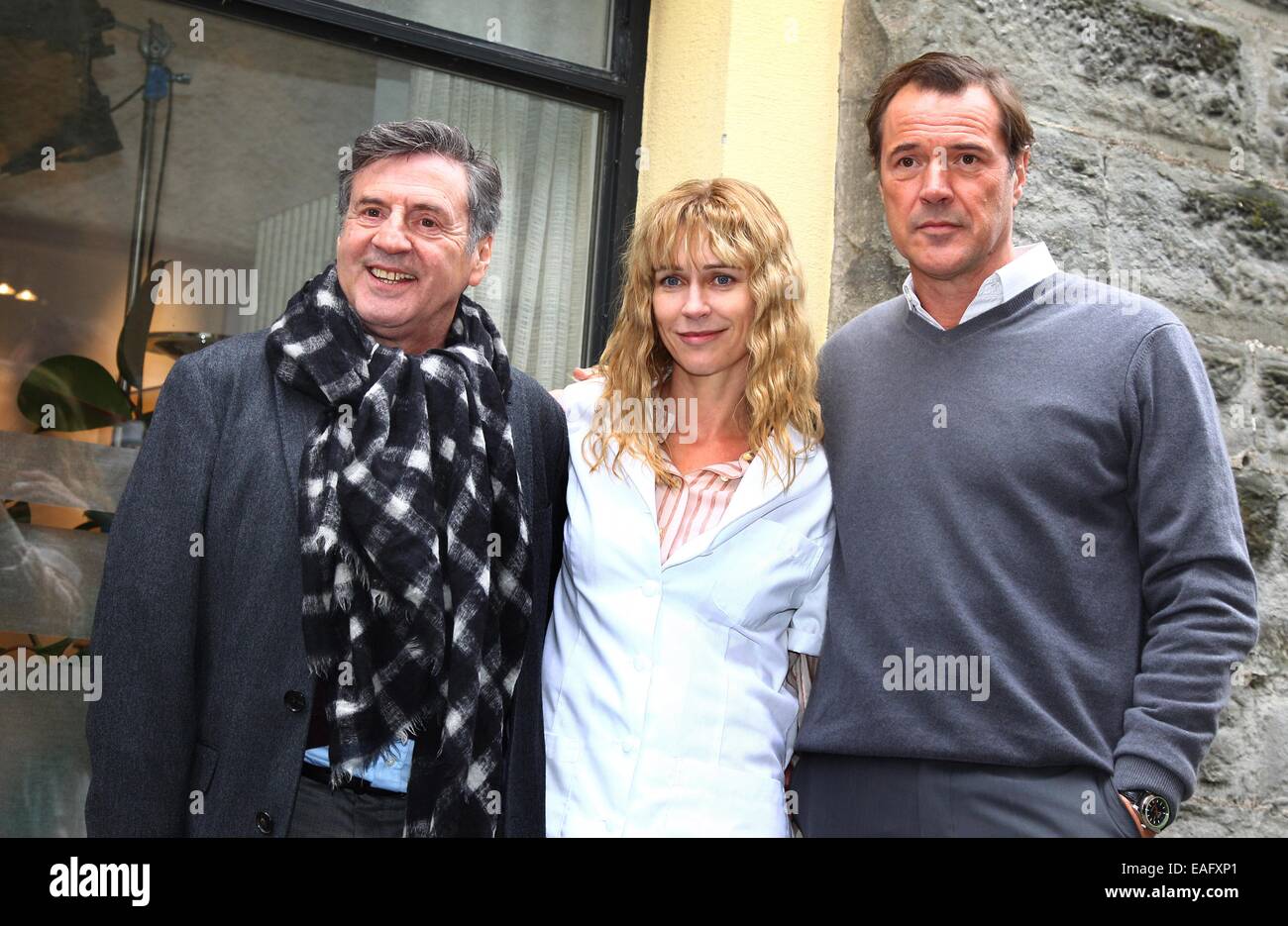 Actors Daniel Auteuil (L-R), Marie-Josee Croze and Sebastian Koch pose on the set of the film 'Bamberski-Der Fall Kalinka' (lit. the Kalinka case) in Lindau, Germany, 14 November 2014. The French and German justice system have been dealing with the Kalinka case since three decades. The film focusses on the death of the 14-year old girl and her father's actions of vigilantism. Photo: Karl-Josef Hildenbrand/dpa Stock Photo