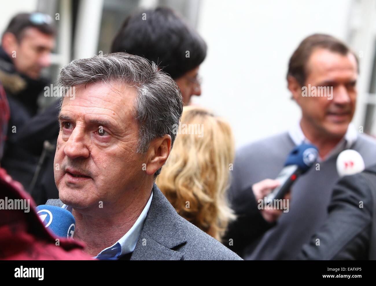 French actor Daniel Auteuil (front) and German actor Sebastian Koch speak to the press during a photocall on the set of the film 'Bamberski-Der Fall Kalinka' (lit. the Kalinka case) in Lindau, Germany, 14 November 2014. The French and German justice system have been dealing with the Kalinka case since three decades. The film focusses on the death of the 14-year old girl and her father's actions of vigilantism. Photo: Karl-Josef Hildenbrand/dpa Stock Photo