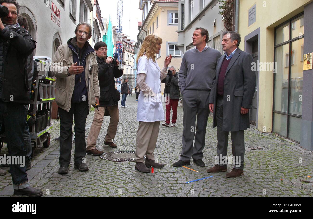 Actors Marie-Josee Croze (C), Sebastian Koch (2-R) und Daniel Auteuil (R) stand on the set of the film 'Bamberski-Der Fall Kalinka' (lit. the Kalinka case) in Lindau, Germany, 14 November 2014. The French and German justice system have been dealing with the Kalinka case since three decades. The film focusses on the death of the 14-year old girl and her father's actions of vigilantism. Photo: Karl-Josef Hildenbrand/dpa Stock Photo