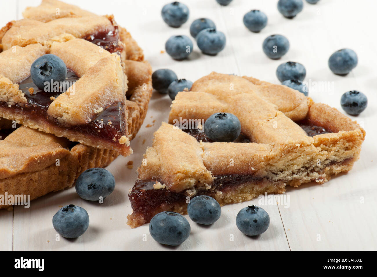 slice of blueberry tart on wooden table Stock Photo