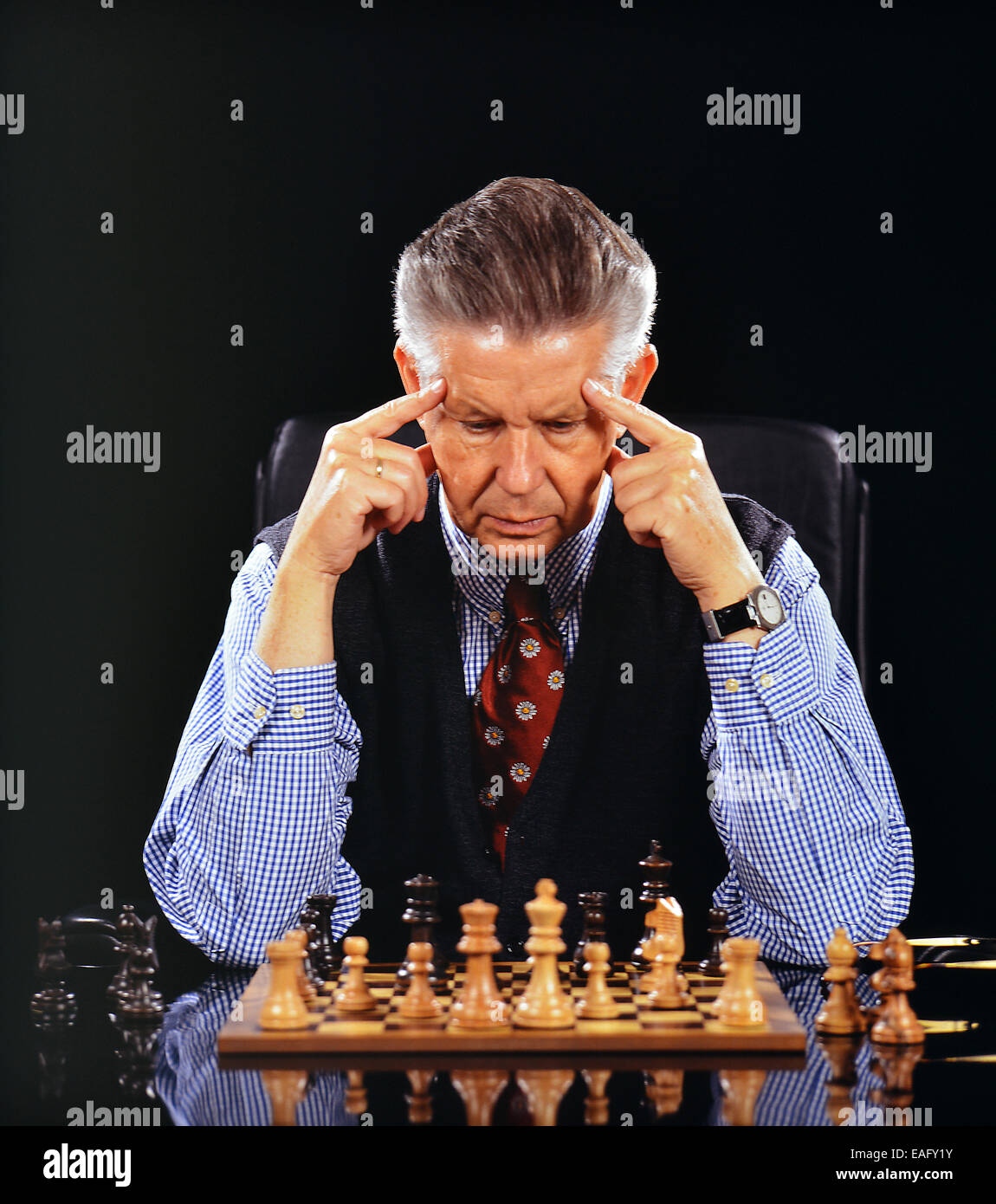 Man playing chess alone and think Stock Photo Alamy