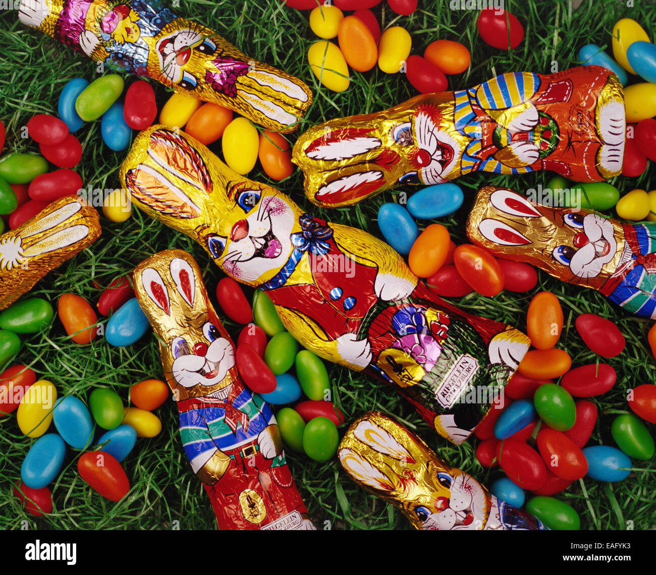 Chocolate Easter Bunny in a basket with sweets Stock Photo Alamy