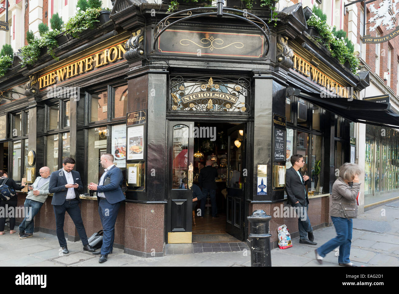 LONDON, UNITED KINGDOM - JUNE 5,  2014: Customers outside 'The White Lion' a popular pub near Covent Garden, London Stock Photo