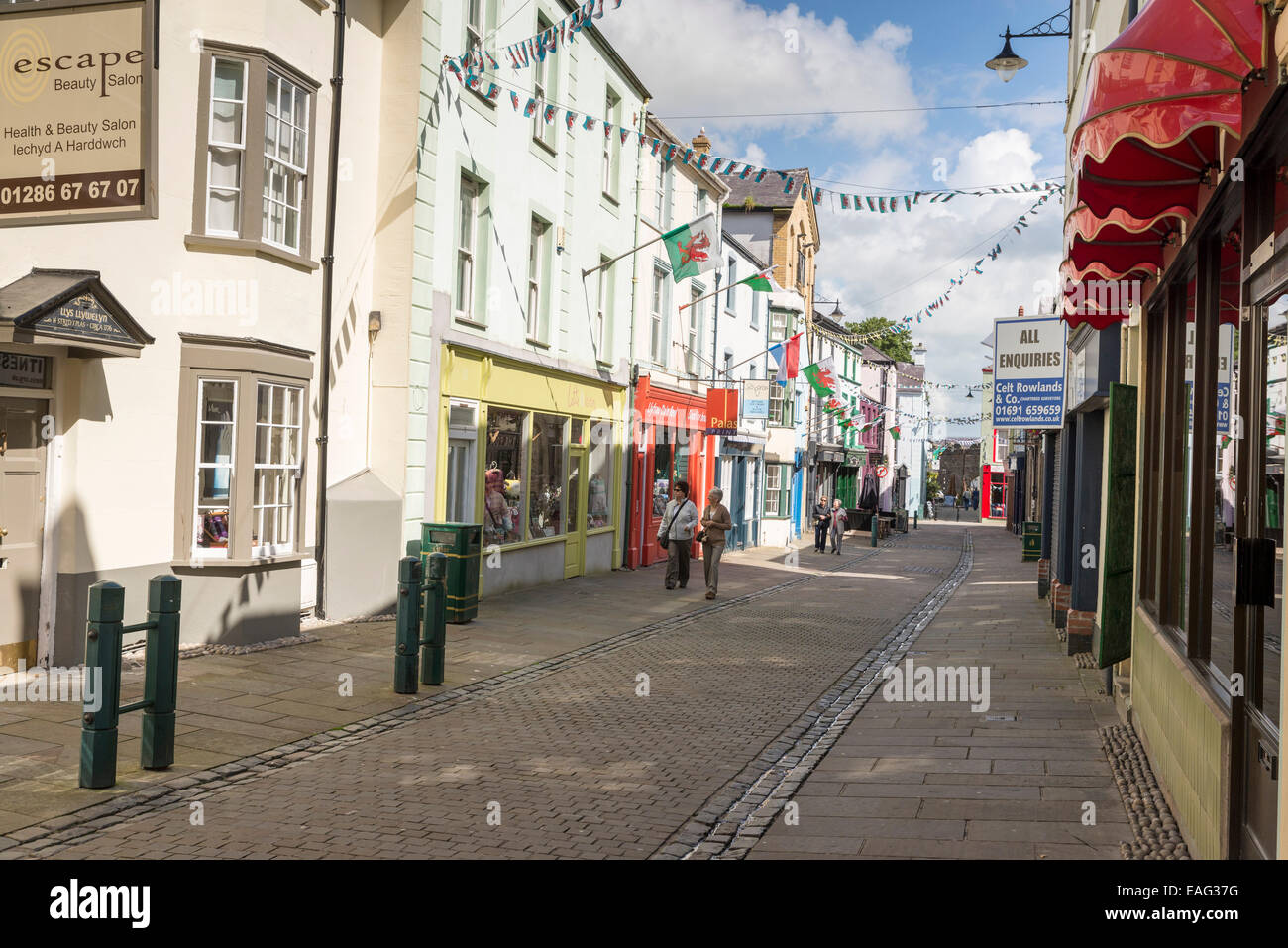 CAERNARFON, UK JUNE 8, 2014 Tourists on a shopping street in