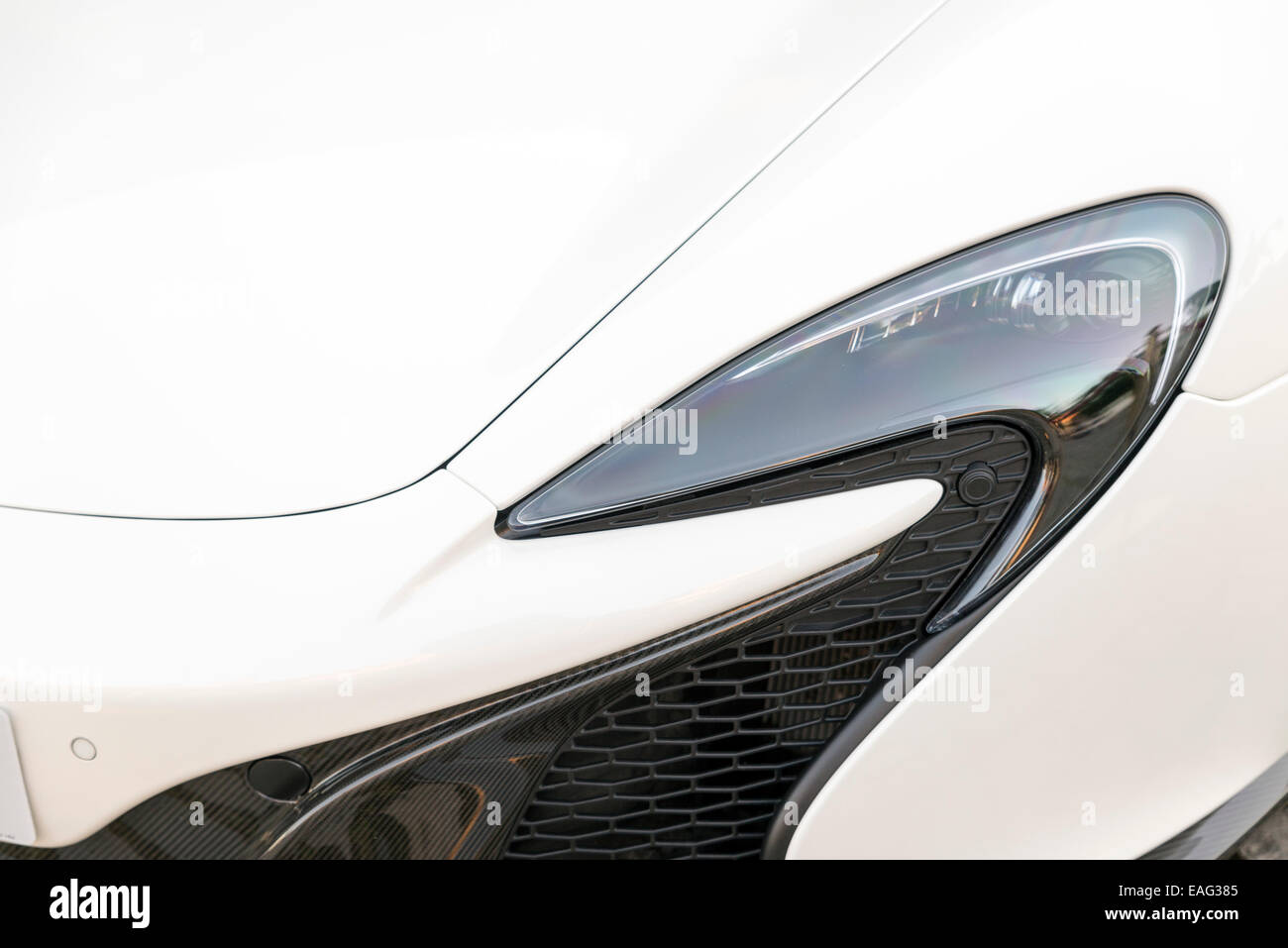 LIVERPOOL, UK - JUNE 8, 2014: Detail of Headlamp of a sports car McLaren 650S Stock Photo