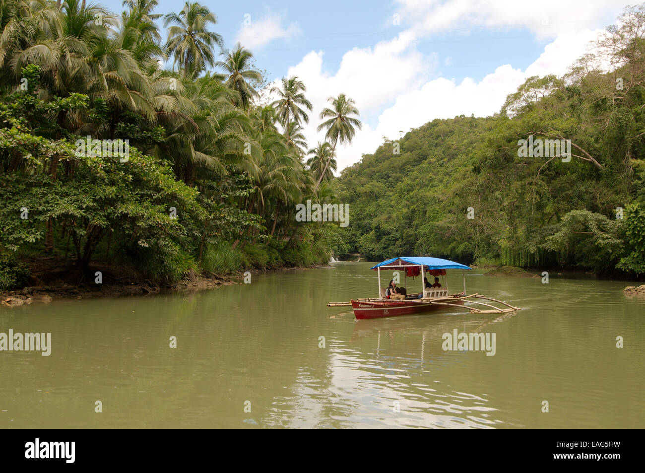 Traditional Philippine boat bangca (outrigger canoe) floats on the ...