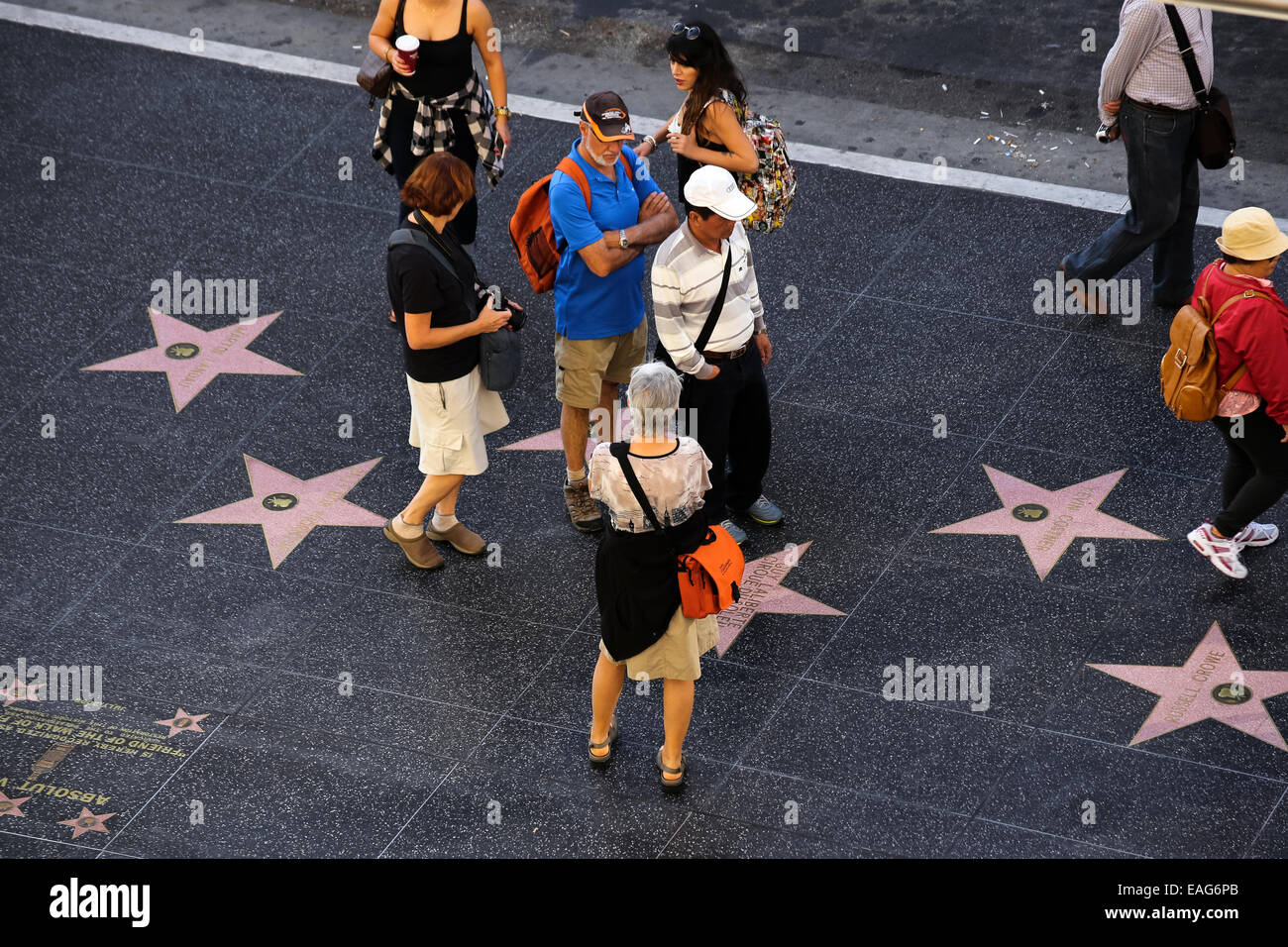 People look at and take photographs of stars on the Hollywood Walk of Fame Stock Photo