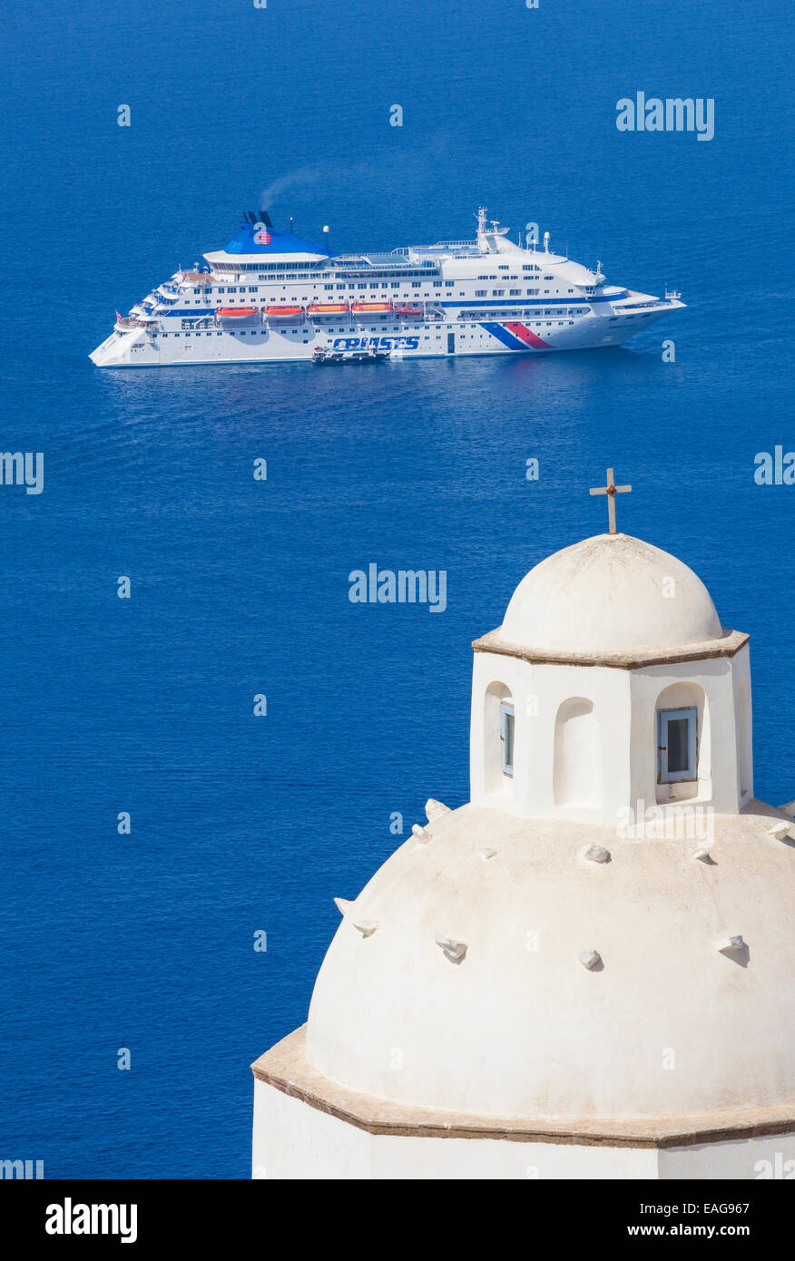 White dome of the church of Agios Minas and cruise ship Fira Santorini, Thira, Cyclades islands, Aegean Sea, Greece, EU, Europe Stock Photo