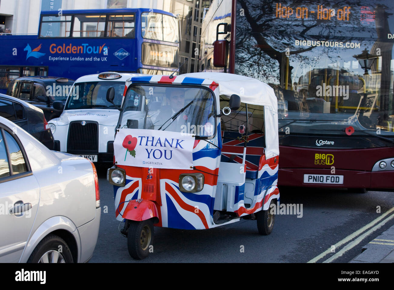 Union jack rickshaw decorated for remembrance day saying thank you on the streets of London England Stock Photo