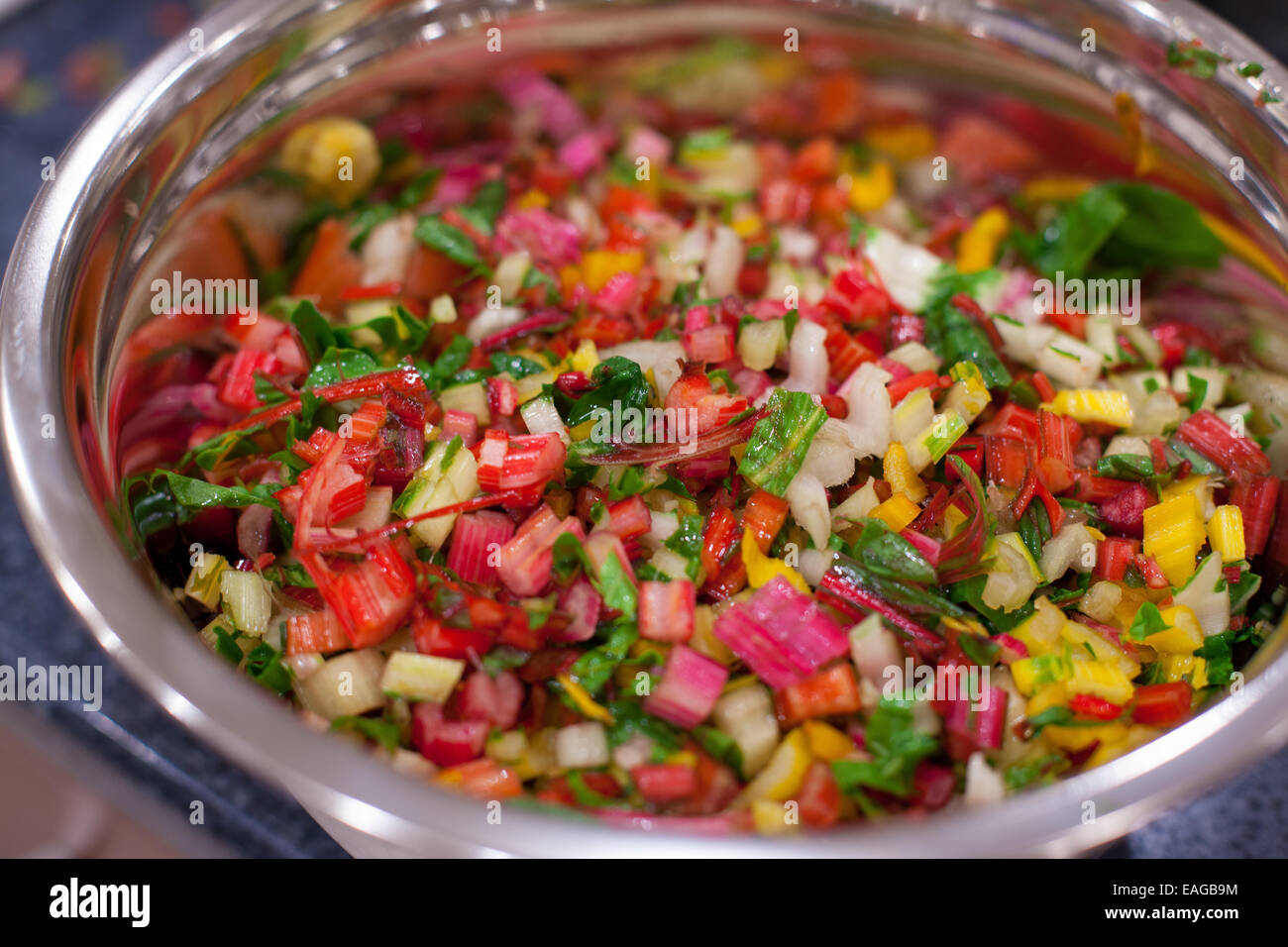 Rainbow swiss chard chopped and diced in a stainless steele bowl Stock Photo