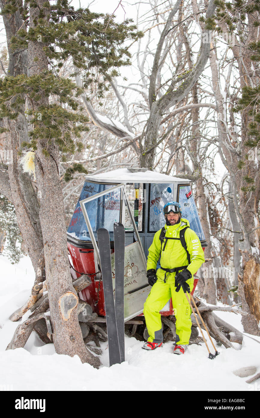 A male skier stops by a gondola fort at Big Sky Resort in Big Sky, Montana. Stock Photo