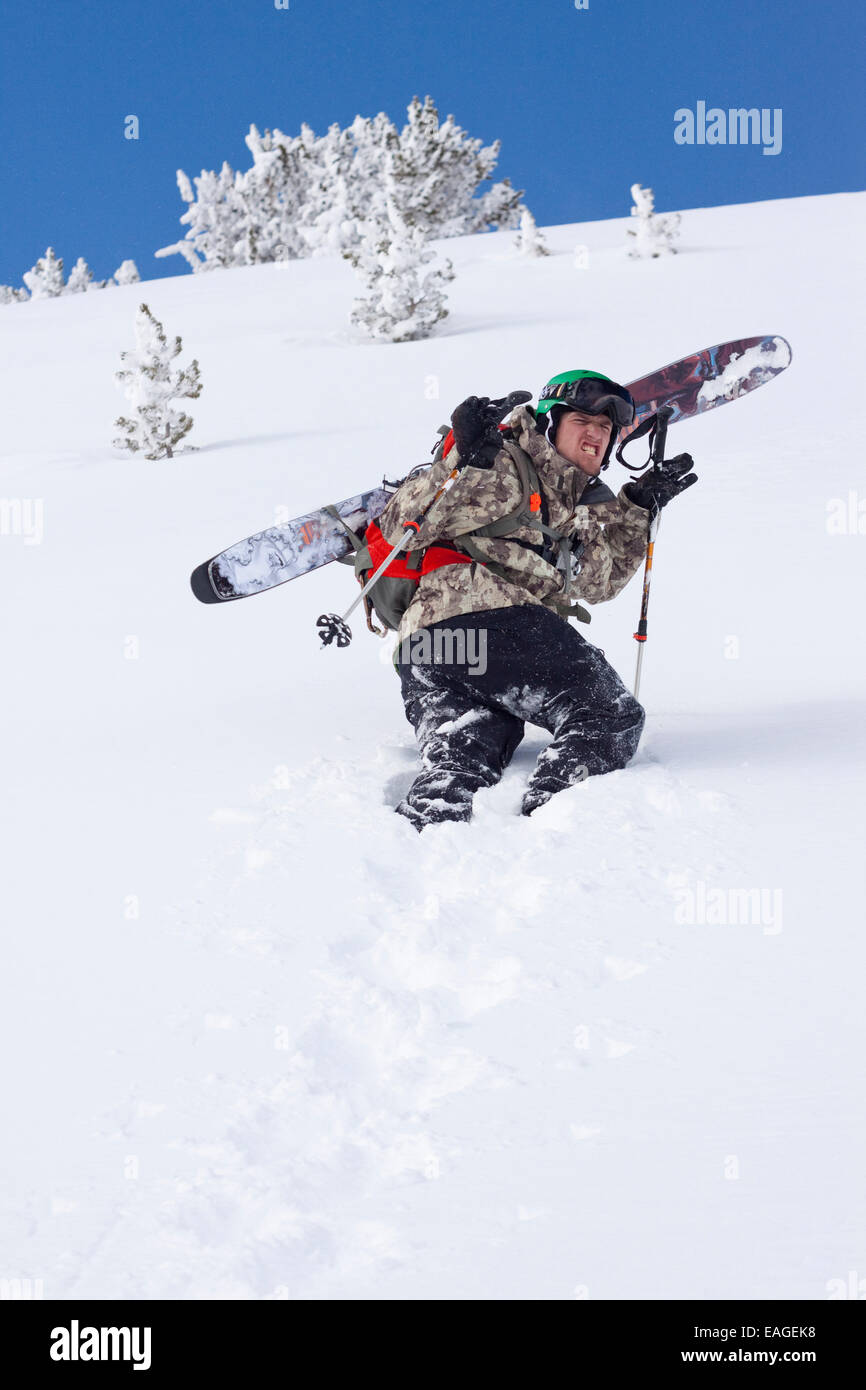 A male skier hikes to his ski line at Big Sky Resort in Big Sky, Montana. Stock Photo