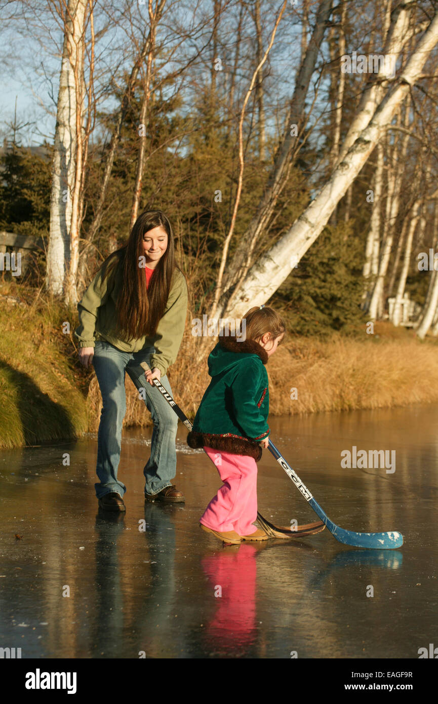 Sarah Palin's Daughters Play Hockey On Frozen Lake Lucille In Wasilla, Alaska 2005 Stock Photo