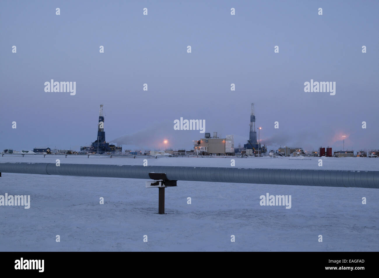 Dusk View Of Two Drill Rigs On The Same Drill Site, Prudhoe Bay, Arctic Alaska, Winter Stock