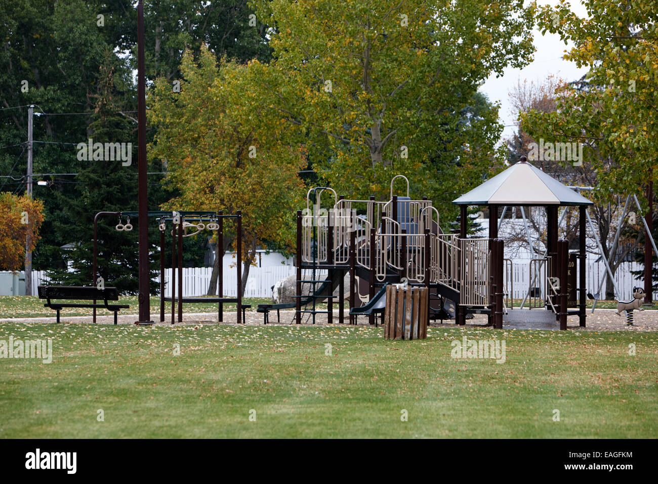 empty childrens play area in public park in fall Saskatchewan Canada Stock Photo