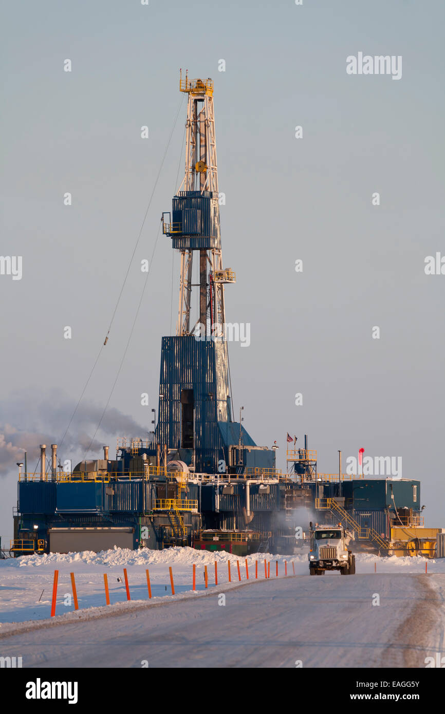 Nabors Oil Rig And Truck On Drill Site Access Road Prudhoe Bay, Arctic Alaska, Winter Stock Photo