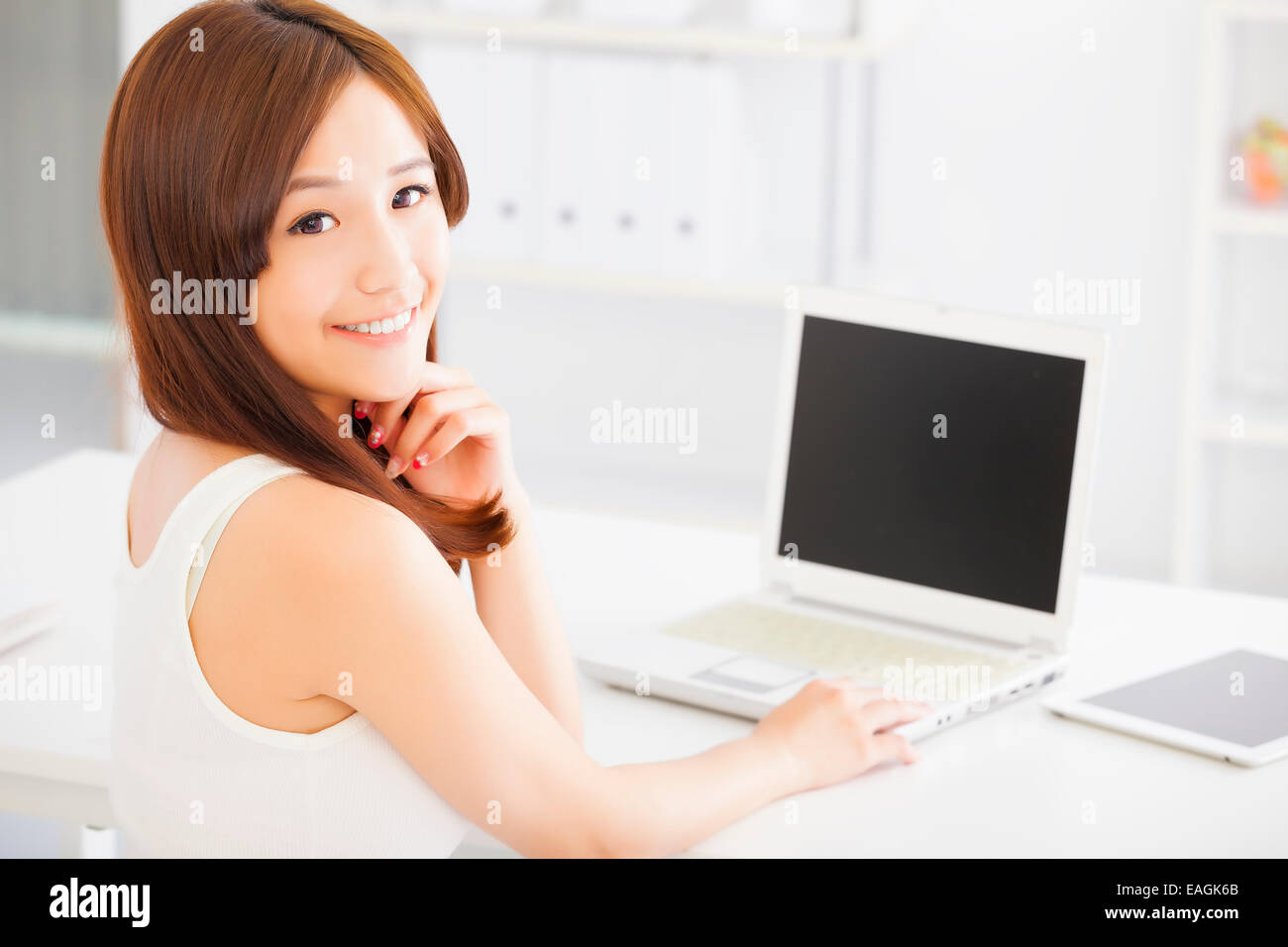Young smiling asian woman with laptop Stock Photo - Alamy