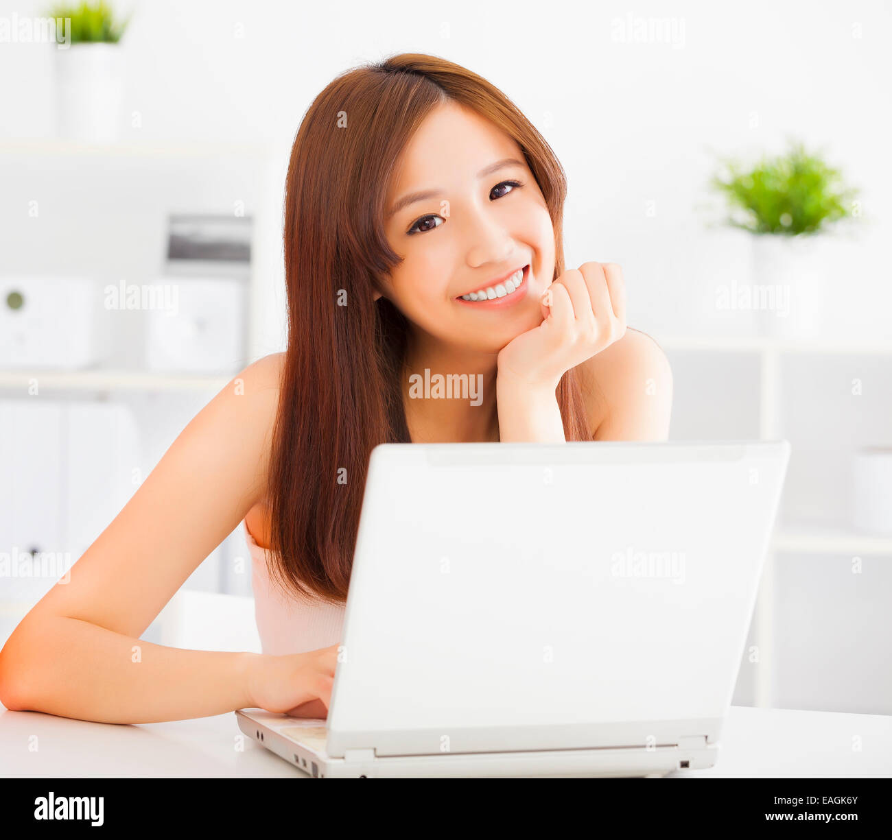 Young smiling asian woman with laptop Stock Photo - Alamy