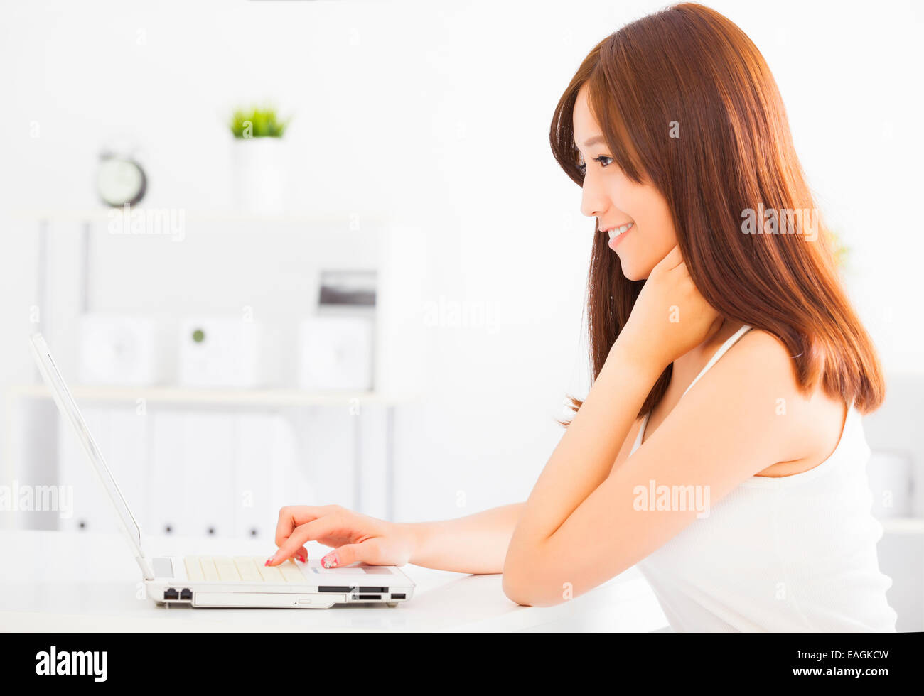 Young smiling asian woman with laptop Stock Photo - Alamy