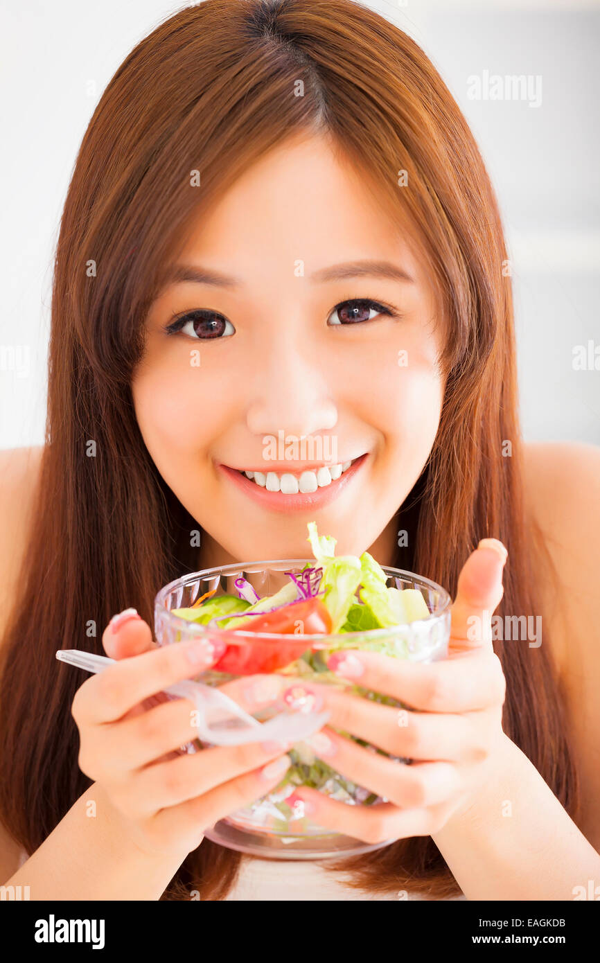 beautiful girl eating healthy food salad Stock Photo