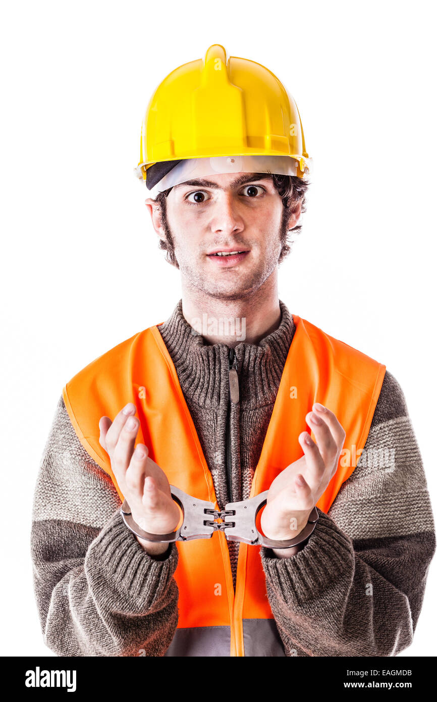an engineer or a foreman wearing hard hat and reflective vest arrested with handcuffs isolated on white Stock Photo