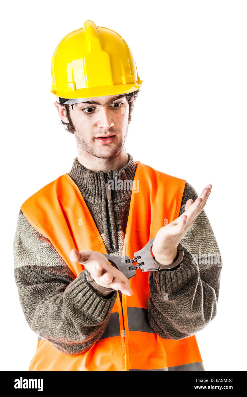 an engineer or a foreman wearing hard hat and reflective vest arrested with handcuffs isolated on white Stock Photo