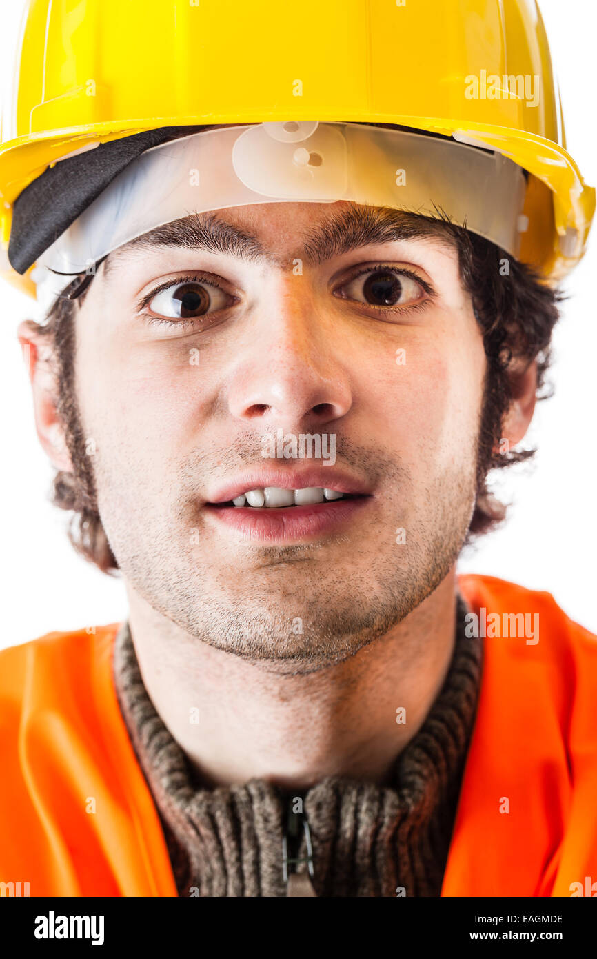 close up portrait of an engineer or a foreman wearing a reflective vest and a yellow hardhat Stock Photo