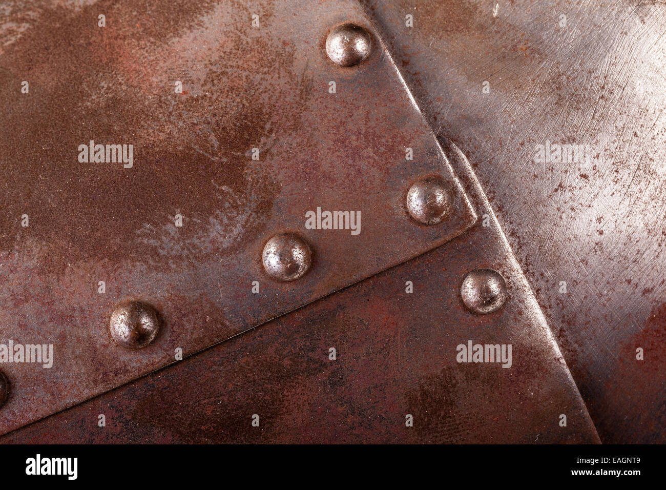 close up shot of an iron armour plate with rivets Stock Photo