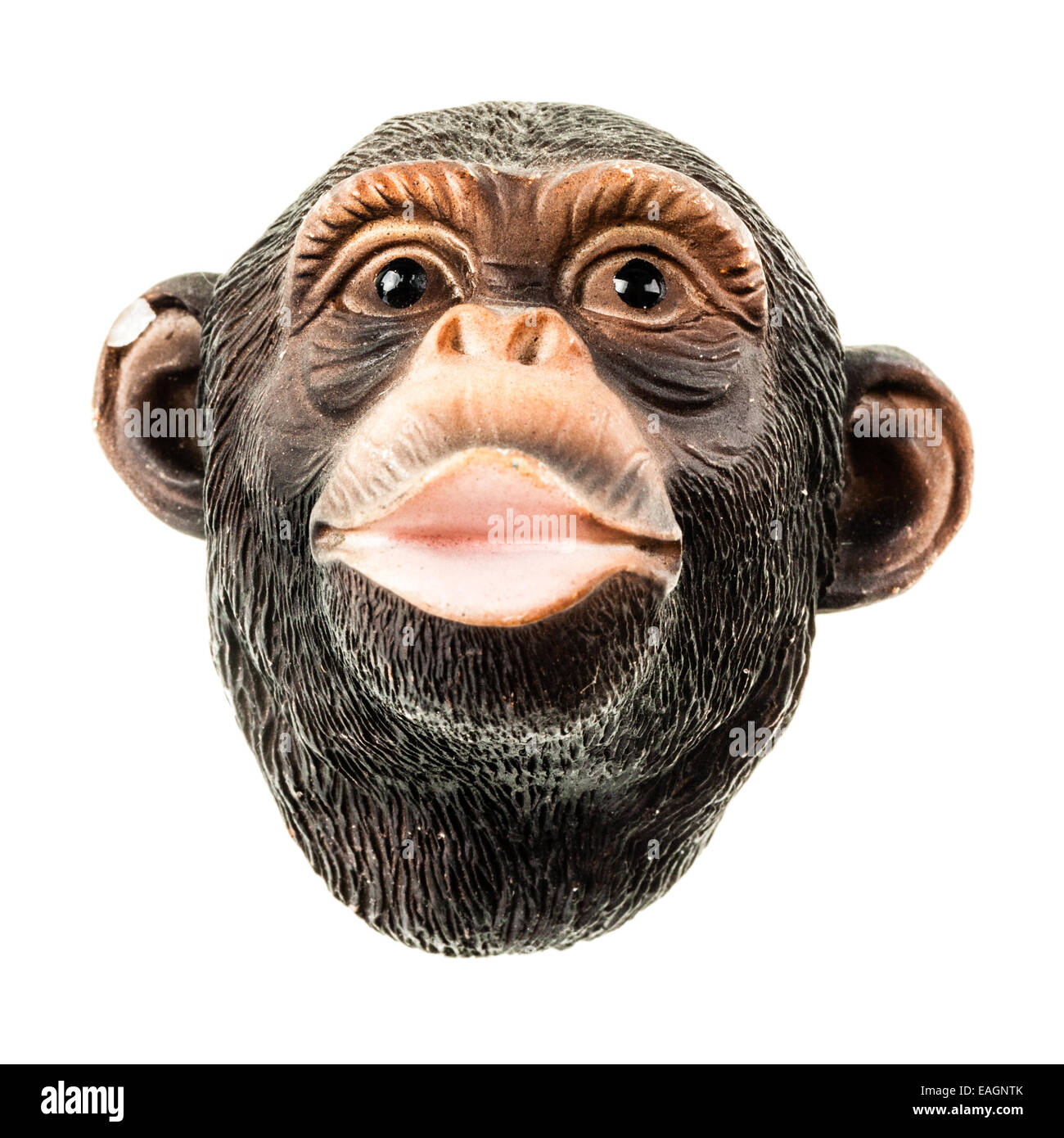 a small ape toy face made in rubber and isolated over white Stock Photo