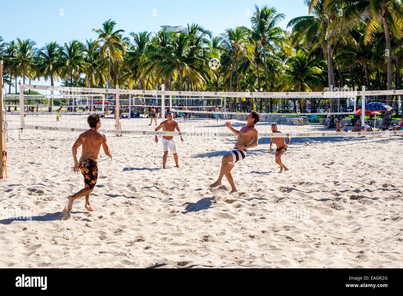Miami Beach Florida,sand volleyball,game,futevÃ´lei,footvolley,Hispanic man men male,playing,teams,net,FL141031024 Stock Photo