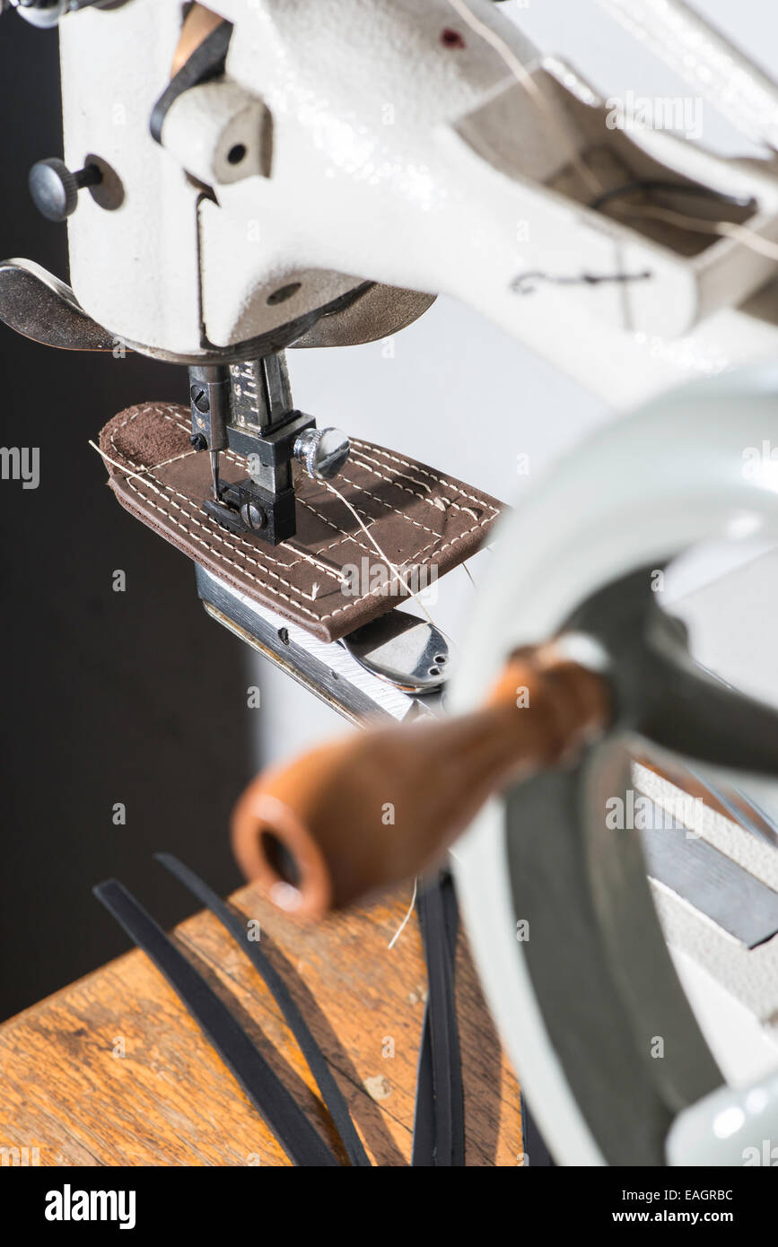 Sewing leather. Manual machine Stock Photo