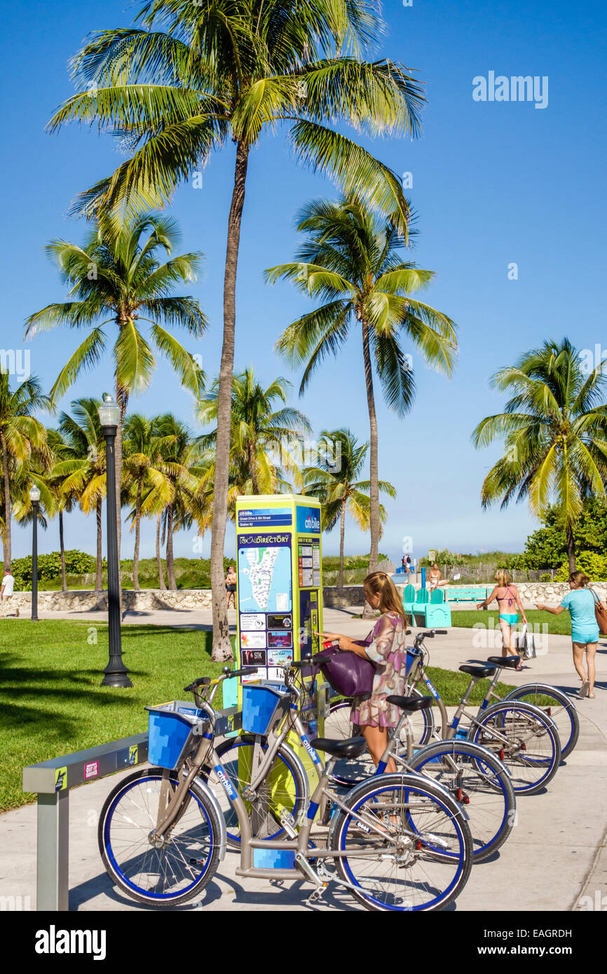 Miami Beach Florida,Lummus Park,Serpentine Trail,DecoBike Citi Bike CitiBike bike sharing system,rental,woman female women,palm trees,FL141031037 Stock Photo