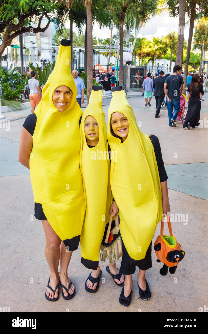 Miami Beach Florida,Lincoln Road,pedestrian mall,Halloween,costume,wearing,outfit,character,woman female women,mother,boy boys male kids children son, Stock Photo
