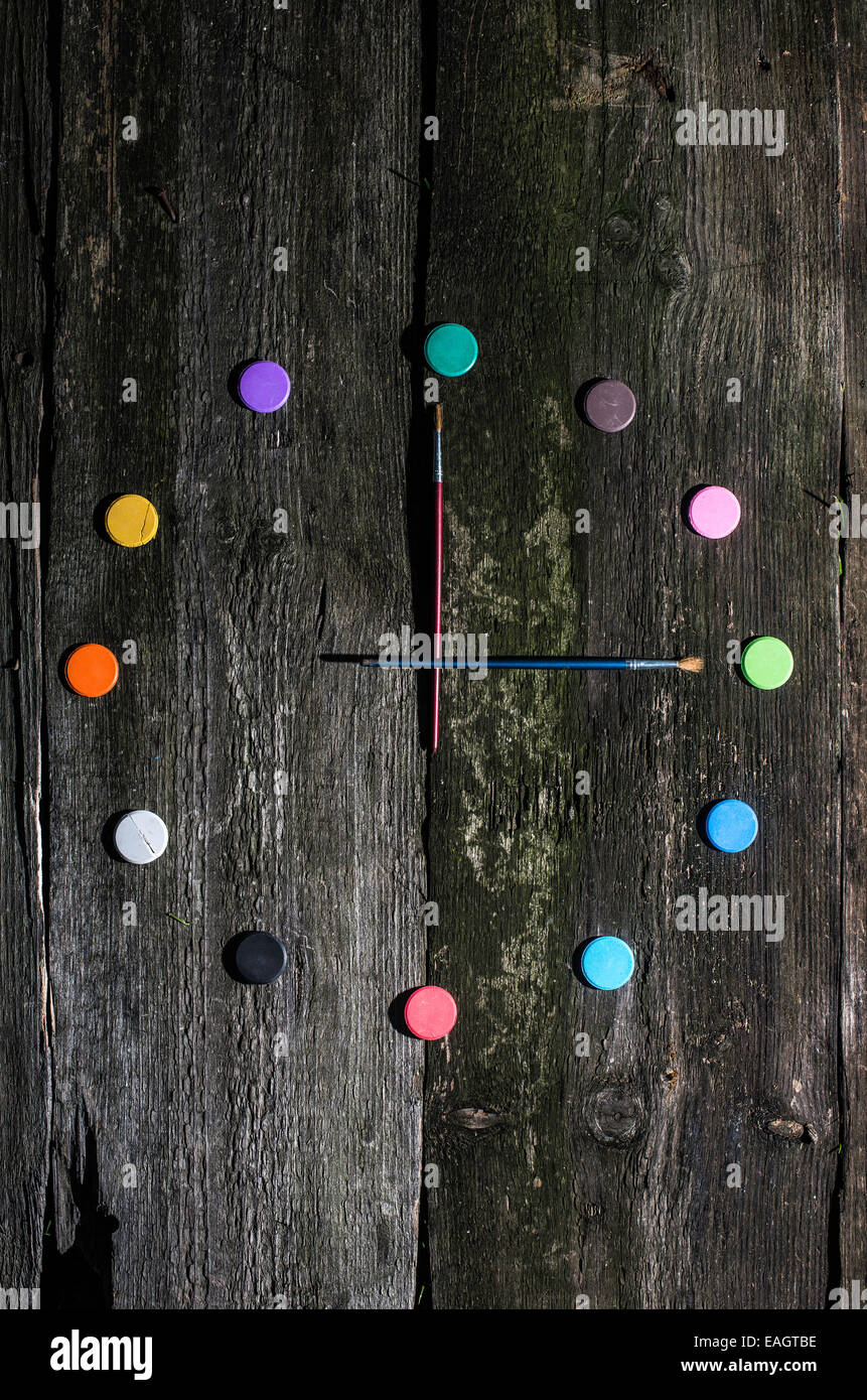 Watercolor paints in clock shape Stock Photo