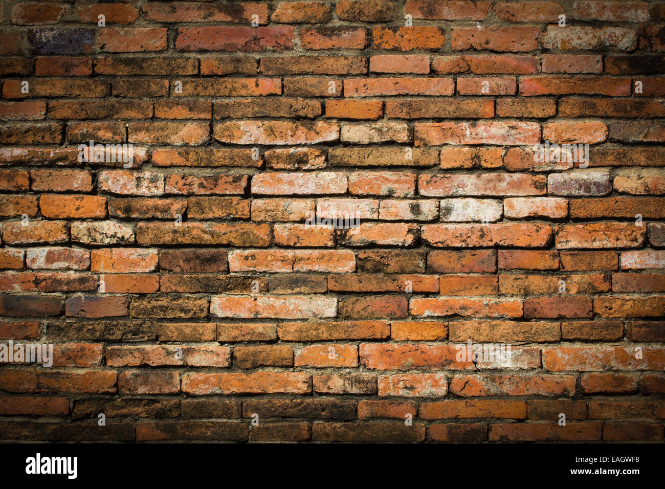 Weathered stained old brick wall background Stock Photo - Alamy