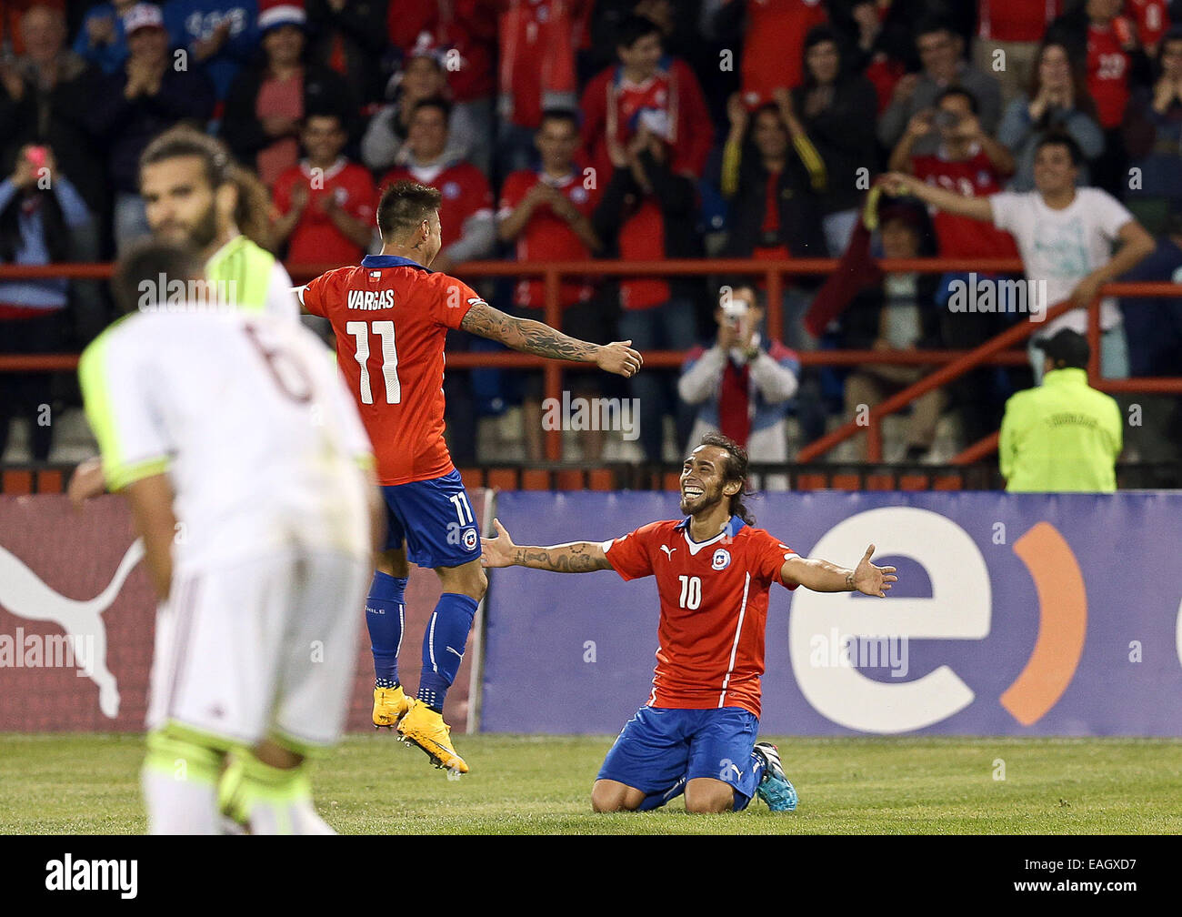 Talcahuano, Chile. 14th Nov, 2014. Image provided by the National Asociation of Professional Soccer shows Chile's Jorge Valdivia (R) celebrating during a friendly match with Venezuela in Talcahuano, Chile, Nov. 14, 2014. © ANFP/Xinhua/Alamy Live News Stock Photo