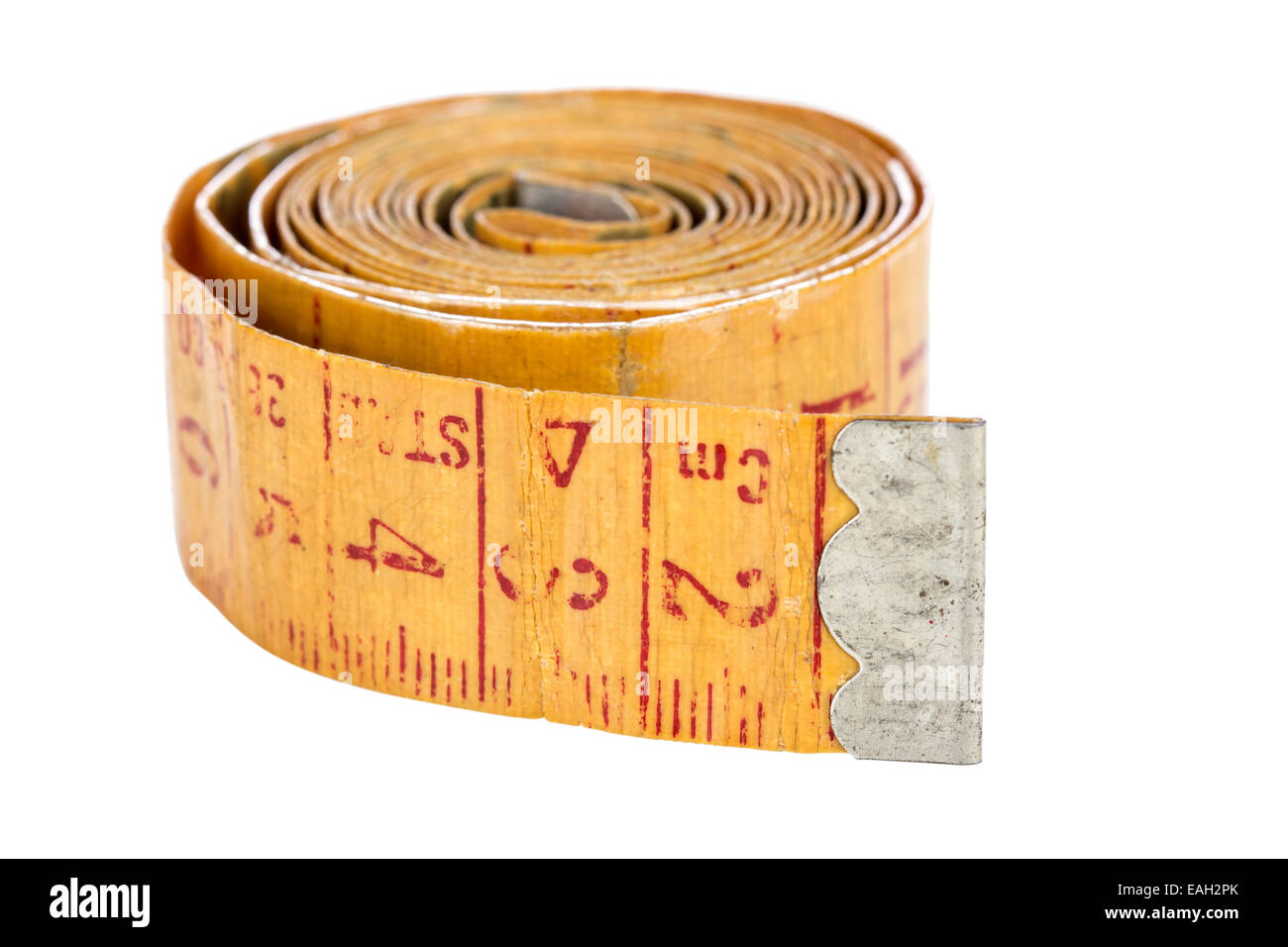 Old yellow measure tape isolated on white with clipping path Stock Photo