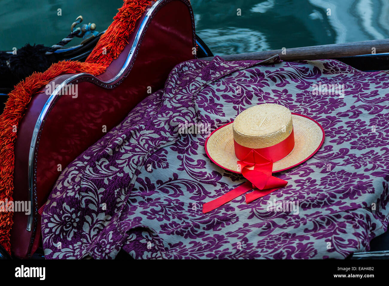 Gondoliers hat on the seat of a gondola Stock Photo
