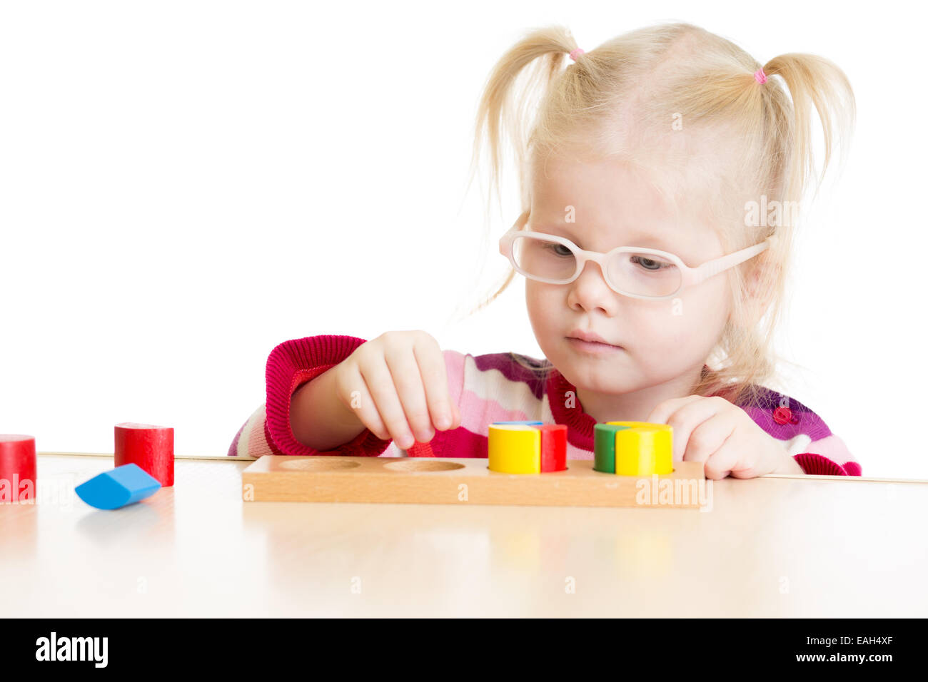 Kid in eyeglases playing logical game isolated Stock Photo