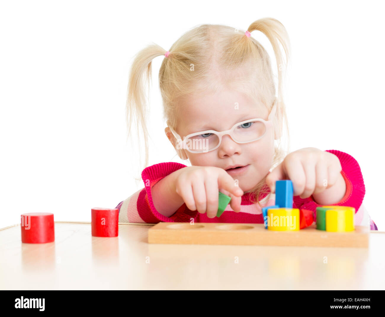 Child in eyeglases playing logical game isolated Stock Photo