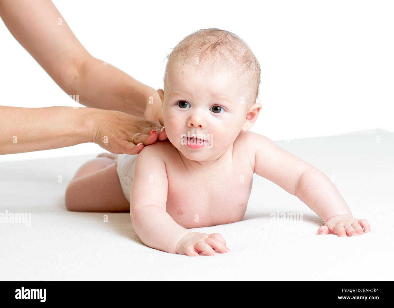 mother give baby back massage Stock Photo