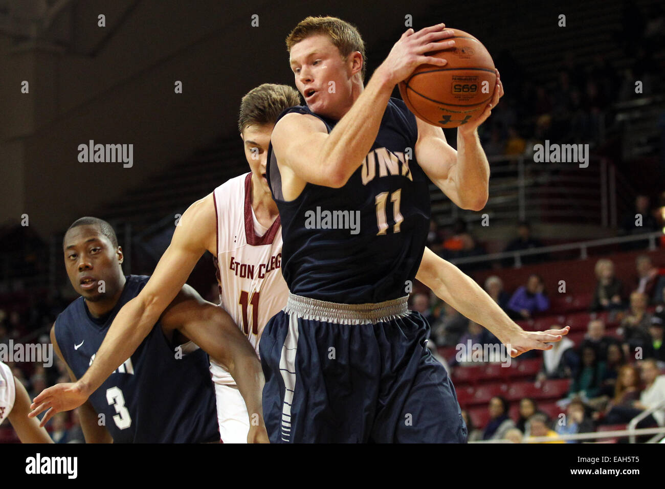 November 14, 2014: New Hampshire Wildcats guard Tommy McDonnell (11) grabs  a rebound during the second half of the NCAA basketball game between the New  Hampshire Wildcats and Boston College Eagles at